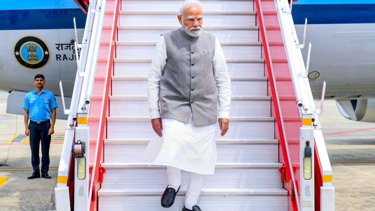 Prime Minister Narendra Modi arrives at an airport, in Varanasi